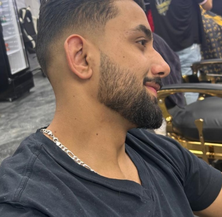 Sharp line up haircut with defined hairline and beard edge detailing