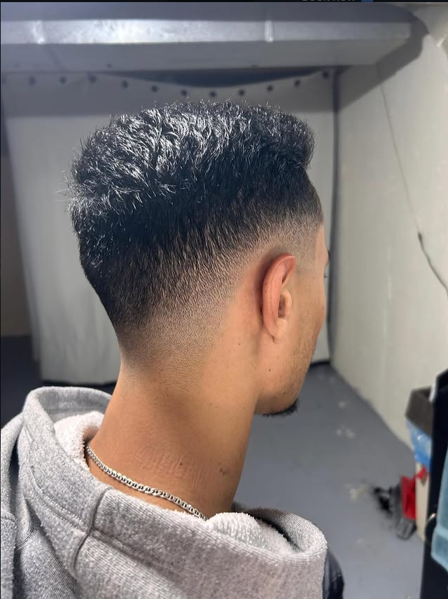 Classic men's signature haircut with smooth fade and textured top in Ottawa